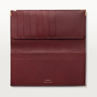 International tegnebog med udvidelsesfolder, Must De Cartier – burgunderfarvet kalveskind, guldfinish – Cartier