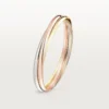 Trinity-armbånd i tricolor-guld, klassisk model | Cartier Us Trinity-armbånd i tricolor-guld, klassisk model | Cartier Us